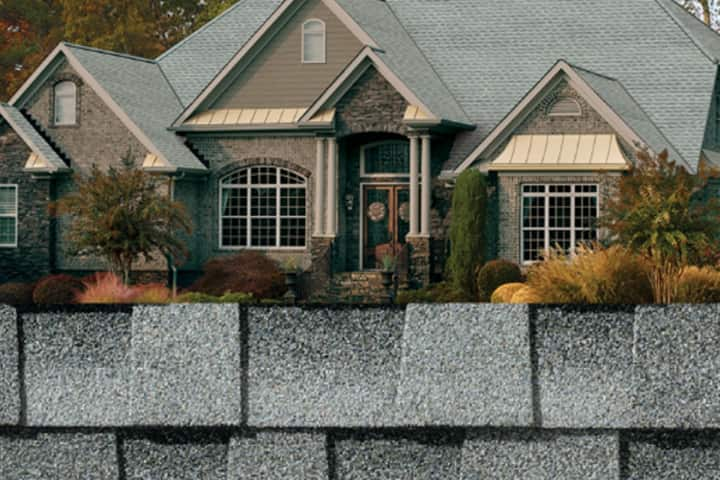 GAF gray shingle closeup along with gray shingles on a taupe house.