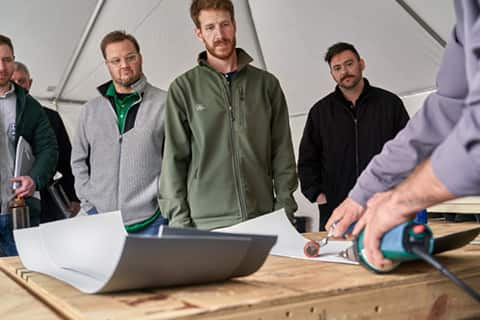 Architects and specifiers watch a GAF instructor during a CARE training course