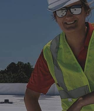 Roofer on a low-slope roof