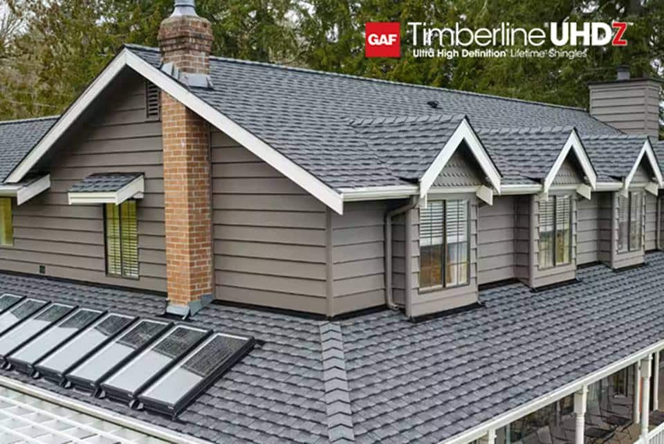 Beauty shot of gray home with UHDZ Pewter Gray shingles.