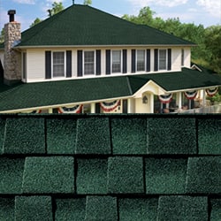 GAF Timberline HDZ hunter green shingle closeup with sample product image on a white house.