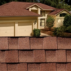 GAF Timberline HDZ sunset brick shingle closeup with sample product image on a beige house.