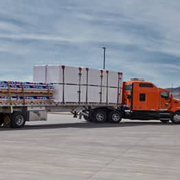 Tractor filled with GAF PVC roofing materials