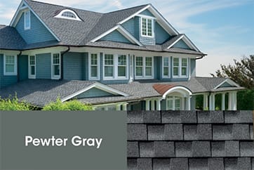 Timberline HDZ Pewter Gray roof shingles, close-up and beauty shot of new roof on a blue house